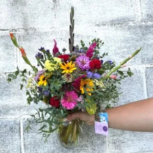 Pink and purple flowers in a summery birthday flower arrangement.