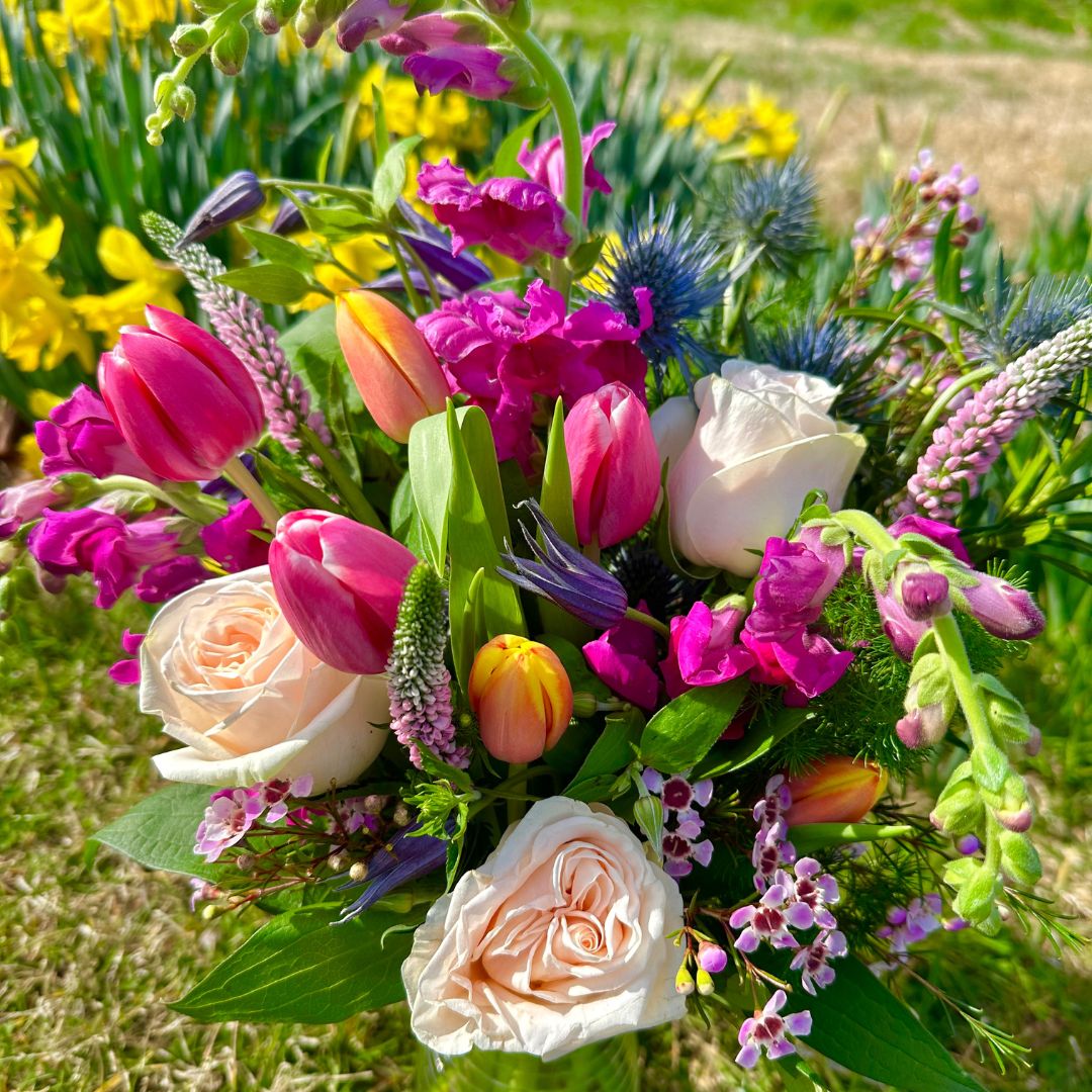 toy-store-20 Spring Easter Flowers arrangement sitting in a bright green field with daffodils