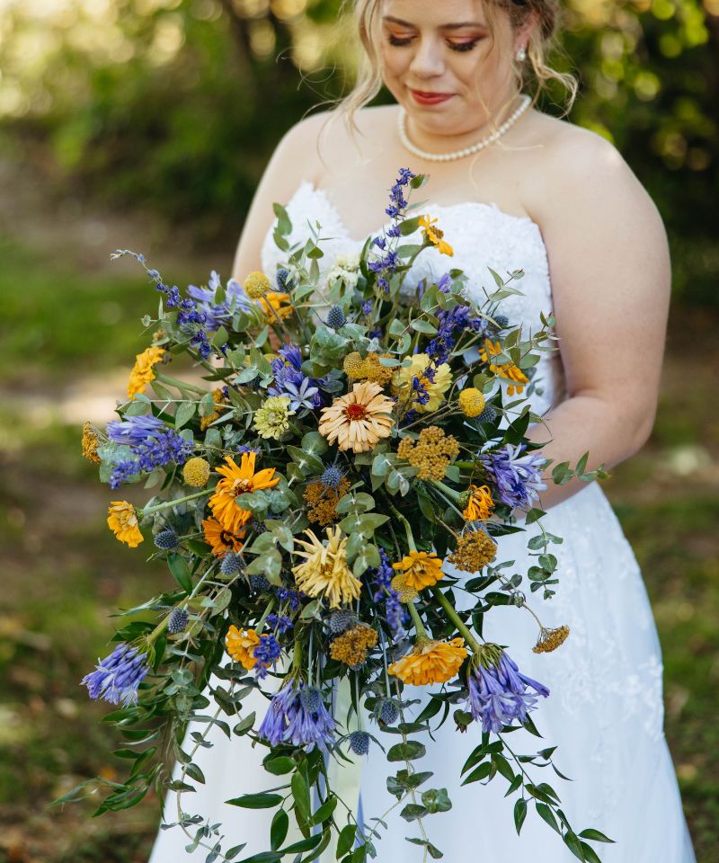 cascading bouquet with gold and blue colors