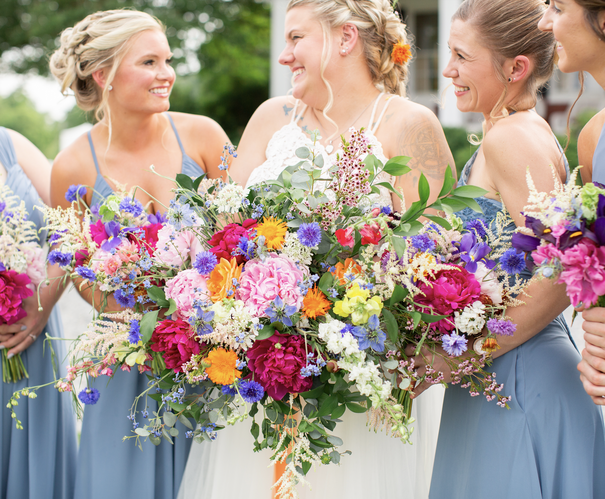Spring wedding with wildflowers that are colorful and vibrant with bride and bridesmaids