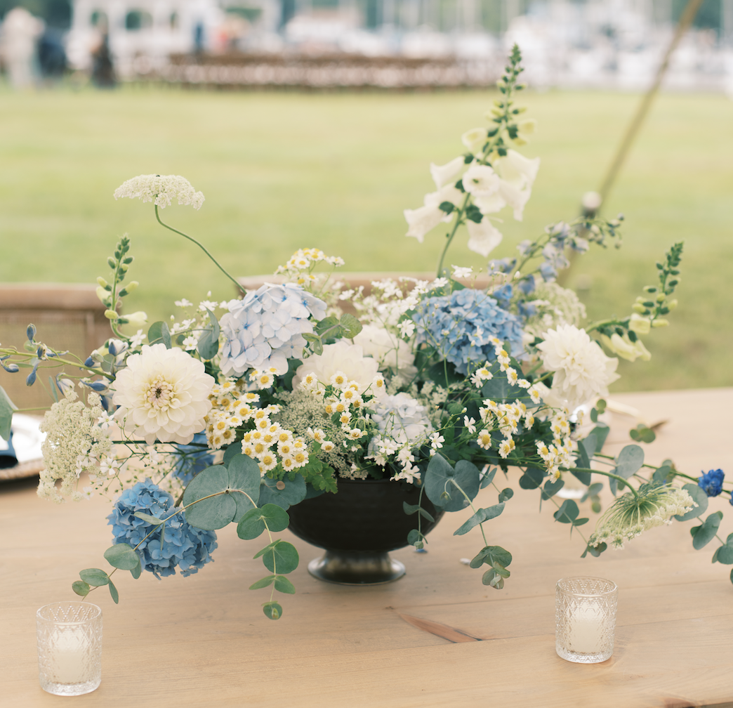 Blue and white compote for wooden sweetheart table with votives