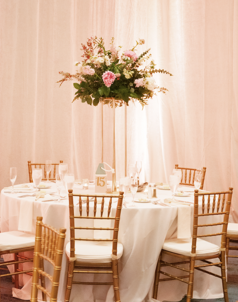 reception table wedding pedestal with spring flowers