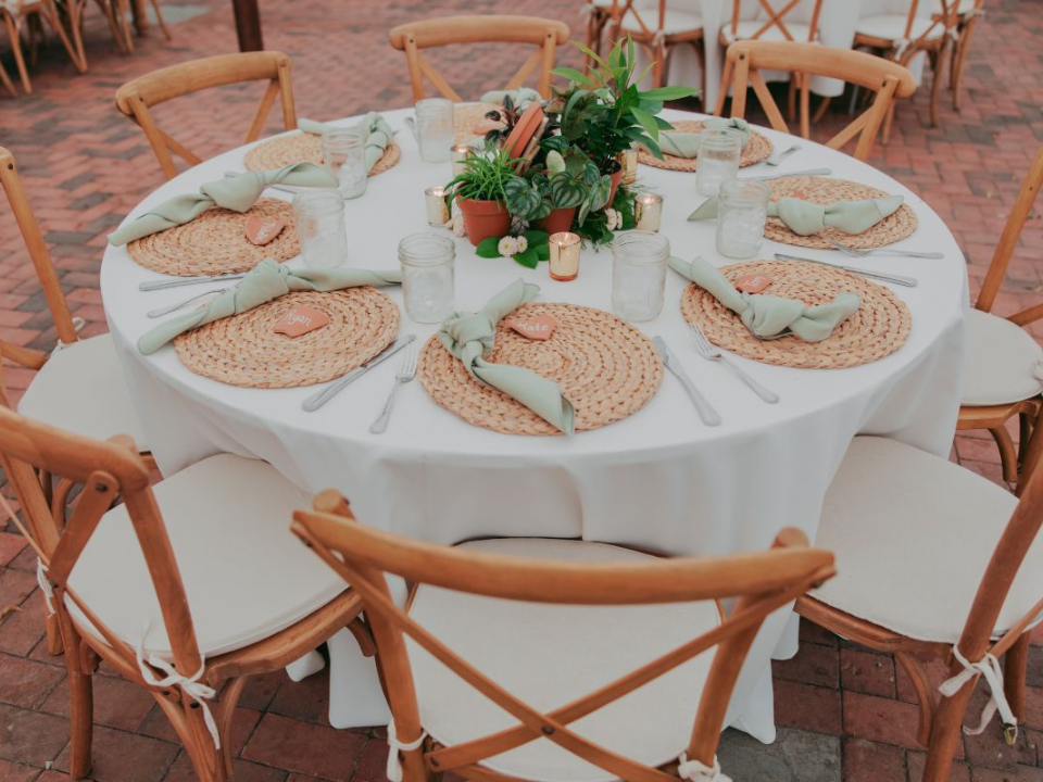 Tablescape with potted plants centerpiece on a round table