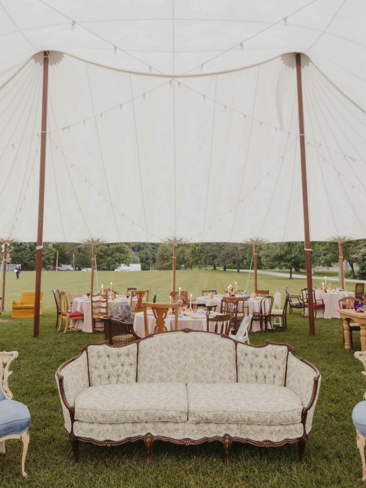 tent with tables and sofa around the dance floor