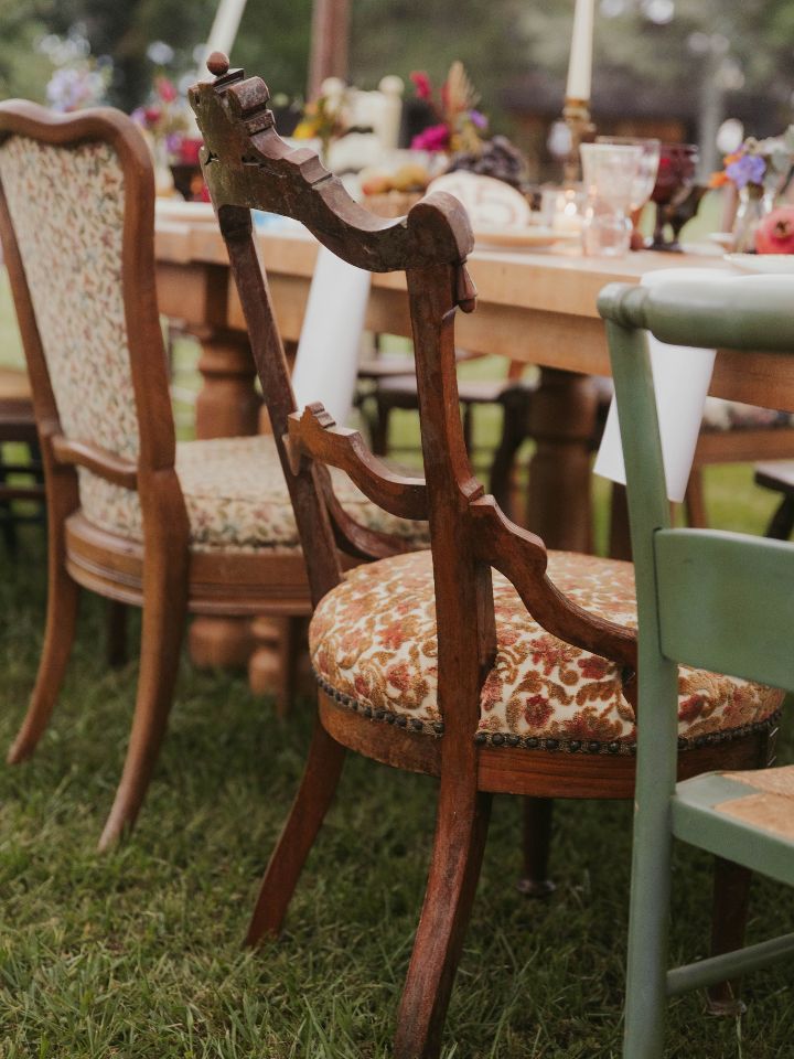 antique chairs under tent wedding reception