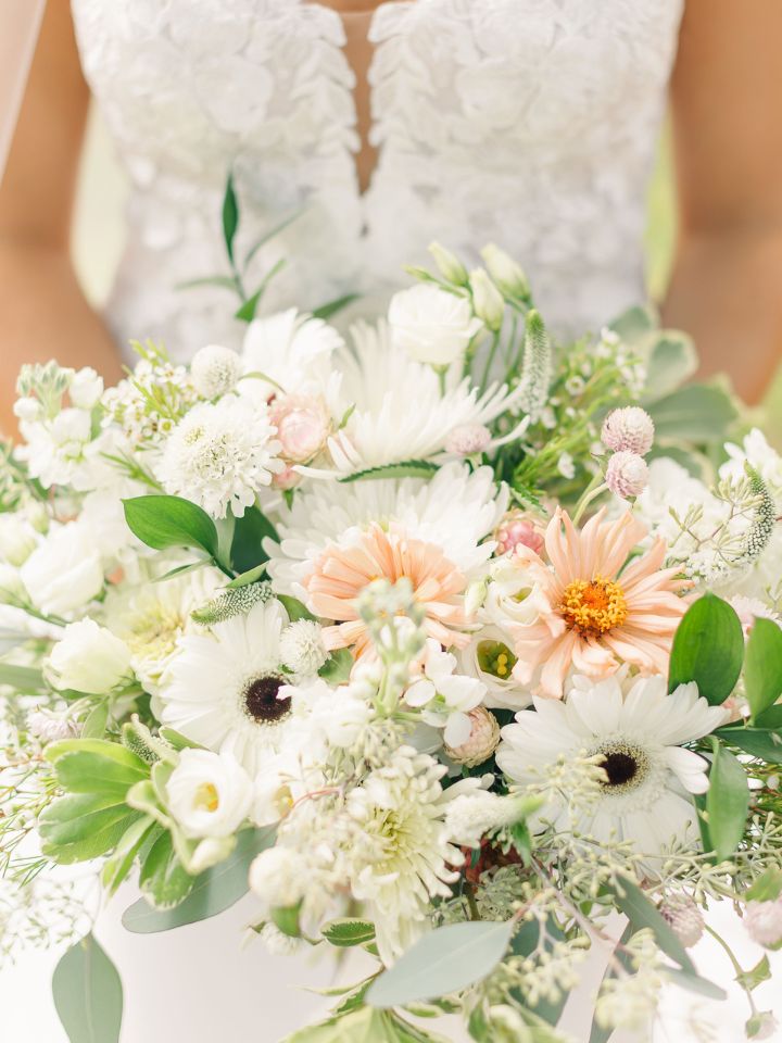bridal bouquet with pastels of white and pink greenery