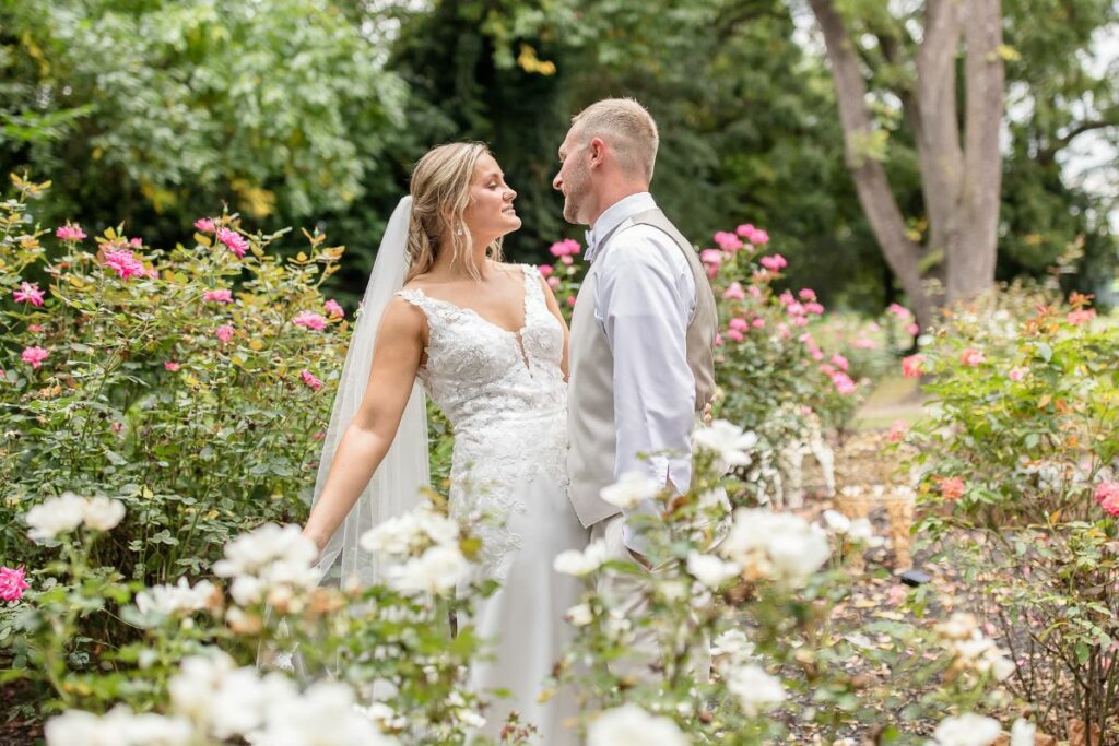 bride and groom in garden on wedding day