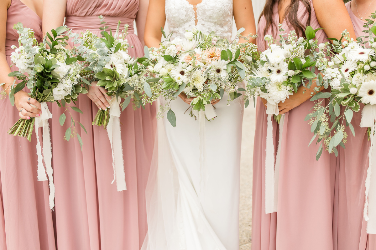 bridesmaid bouquets with bride and trailing ribbon