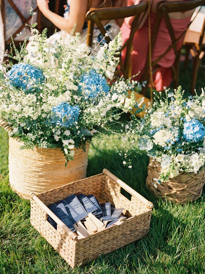 back of aisle flowers blue and white in baskets