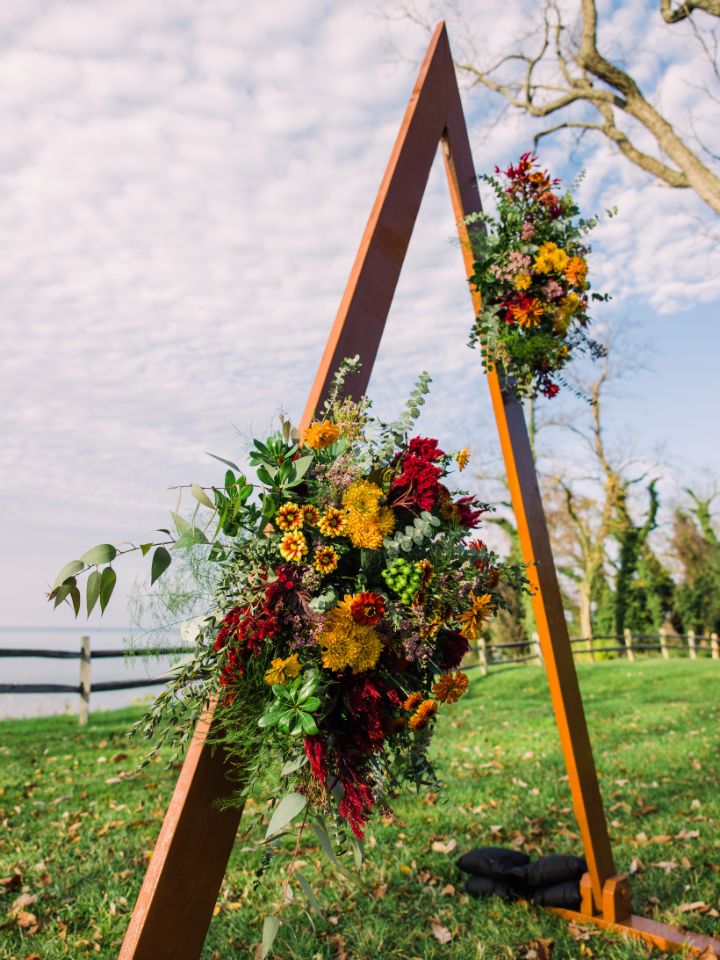 triangle arch with colorful flowers