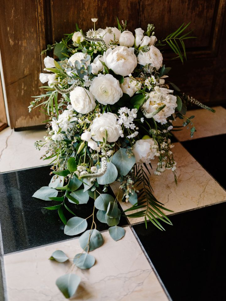 white cascading bouquet with greenery and florals