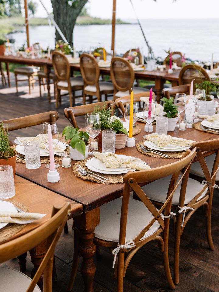 harvest tables with place setting and plants