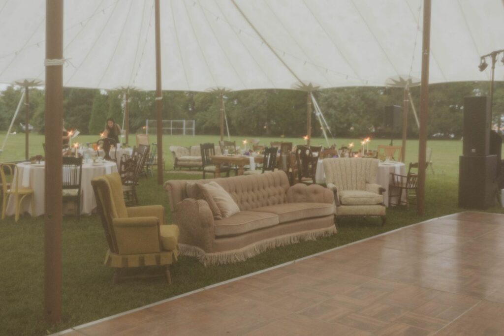 reception tent area with sofas and chairs