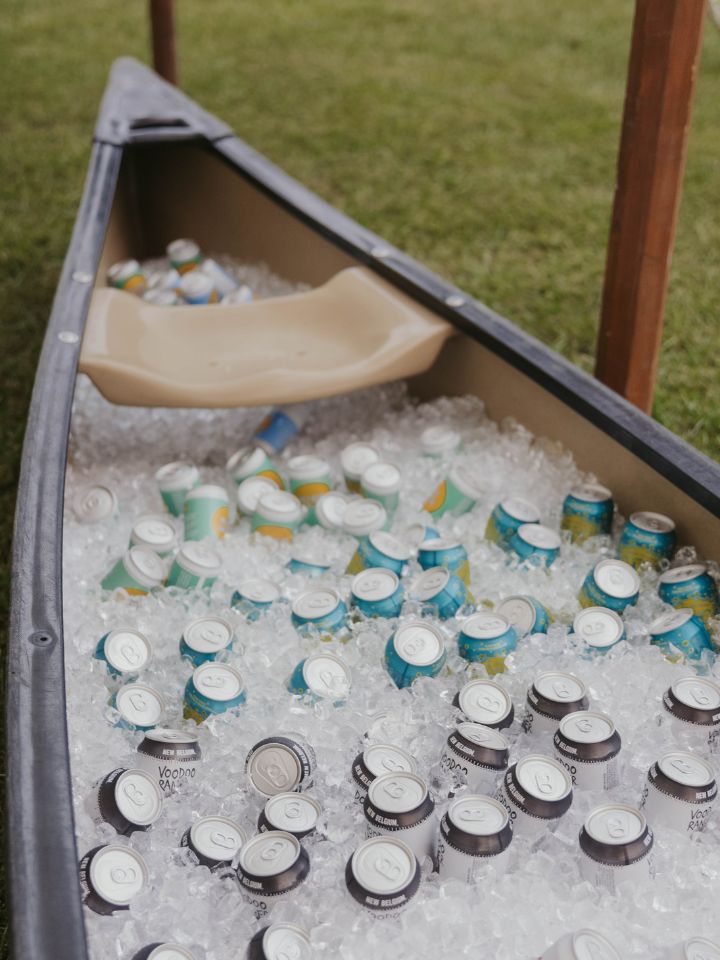 canoe filled with cooler and drinks