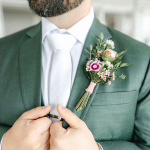 Flower Boutonniere on a dark green suit