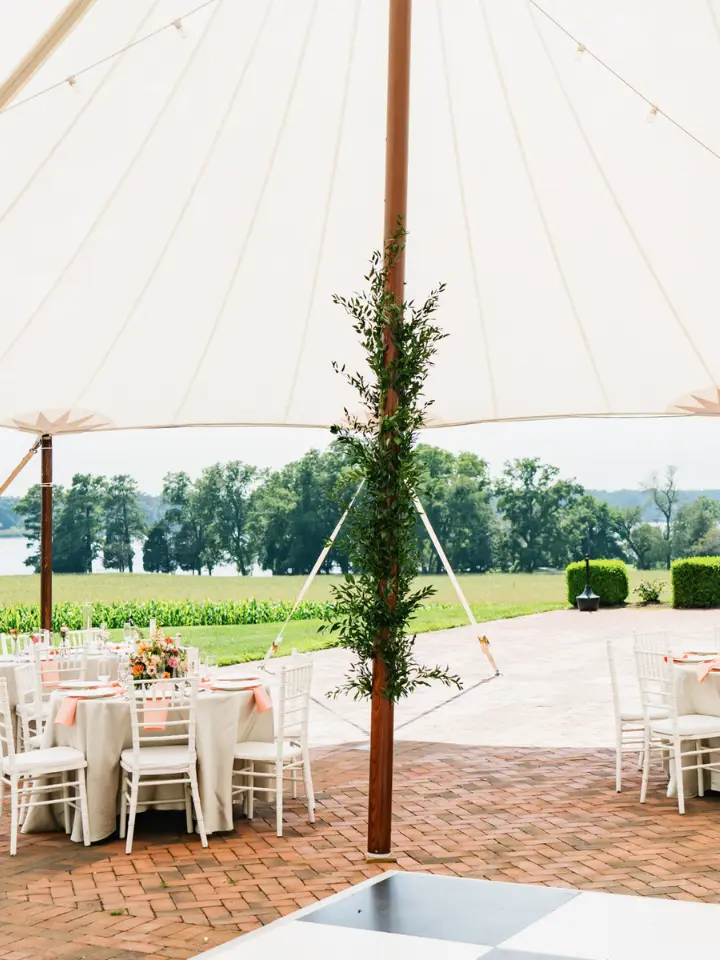 Greenery wrapped around a Sailcloth Tent center pole 