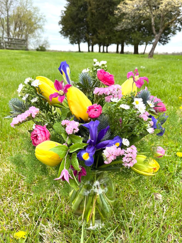Mother's Day Flowers in a vase sitting in the grass