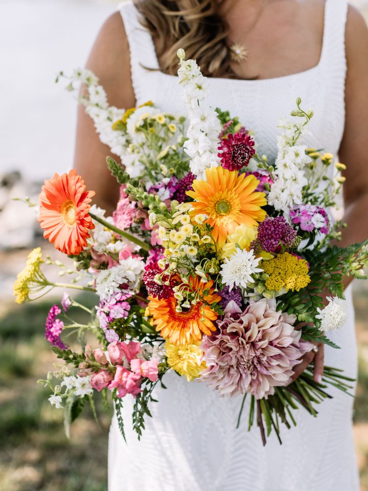 Bridal bouquet in bright citrus wedding colors.