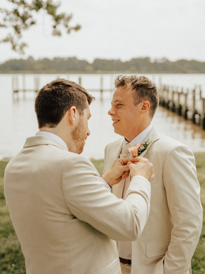 Boutonniere is pinned on to the groom at Brittland Manor wedding