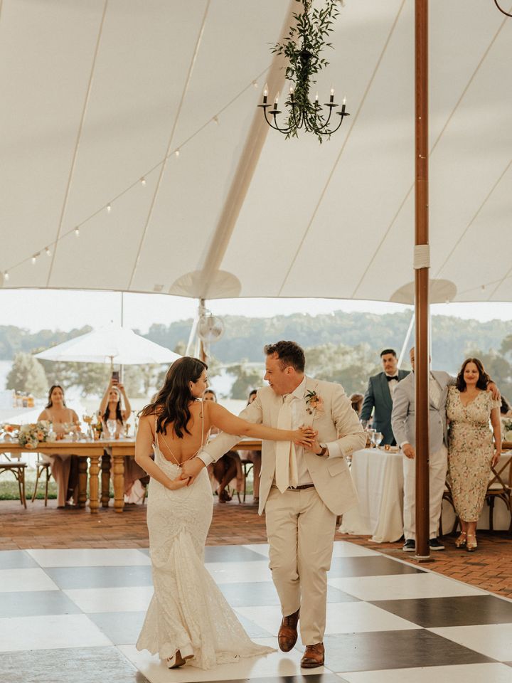 Bride and groom dance under sailcloth tent at Brittland Manor