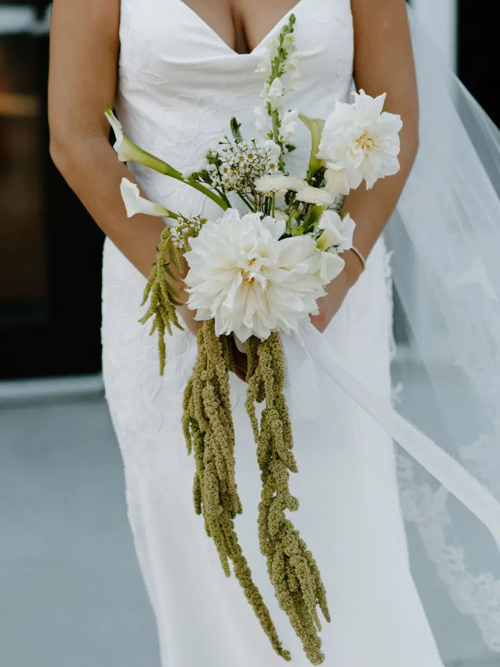 Cascading petite bouquet with greenery and white florals