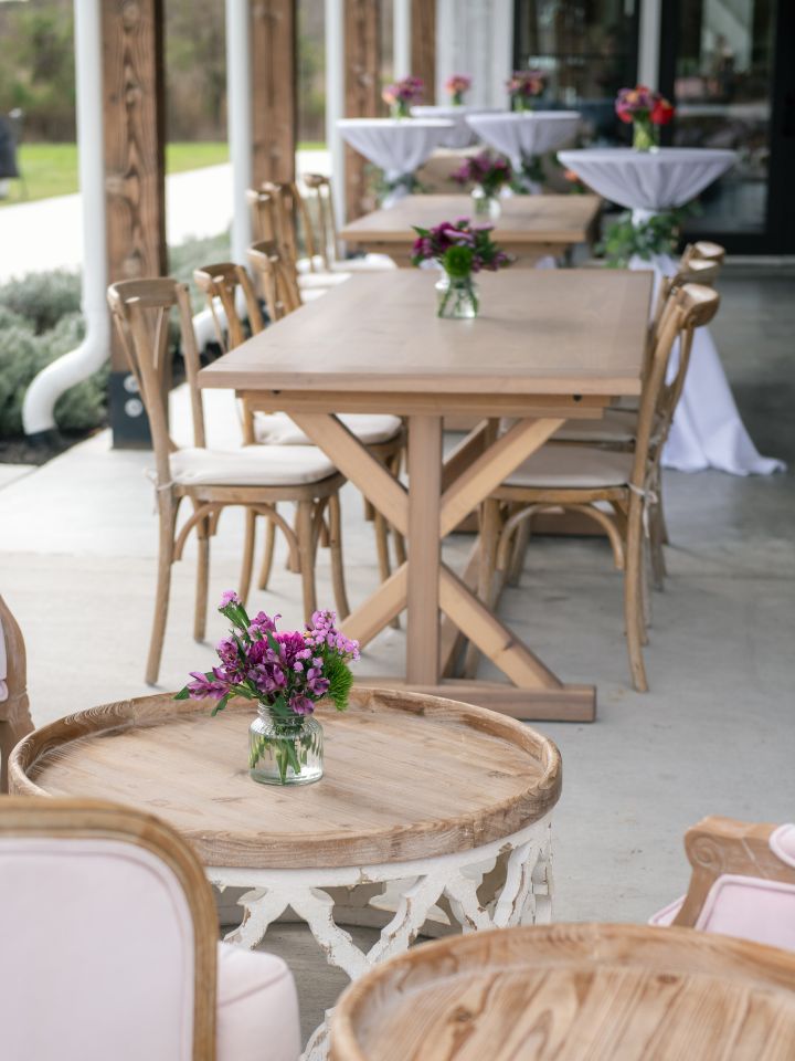 Cocktail Table vases are scattered around on the side patio of the Farmstead.