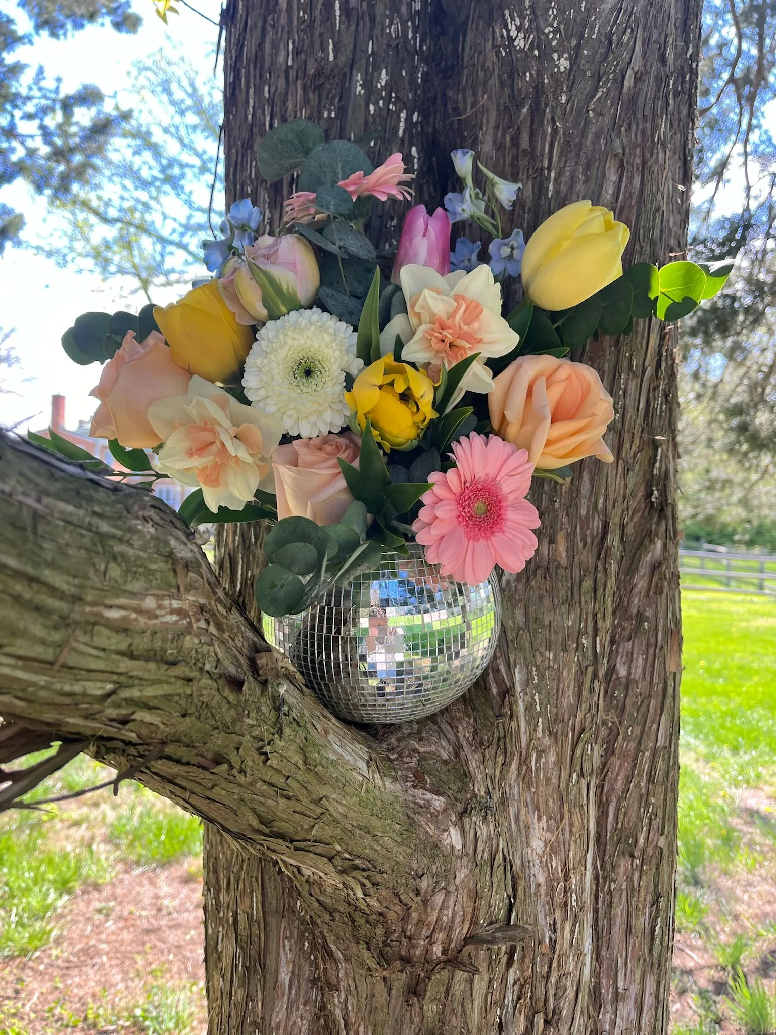 toy-store-20 A spring colored florals disco ball arrangement in a tree.