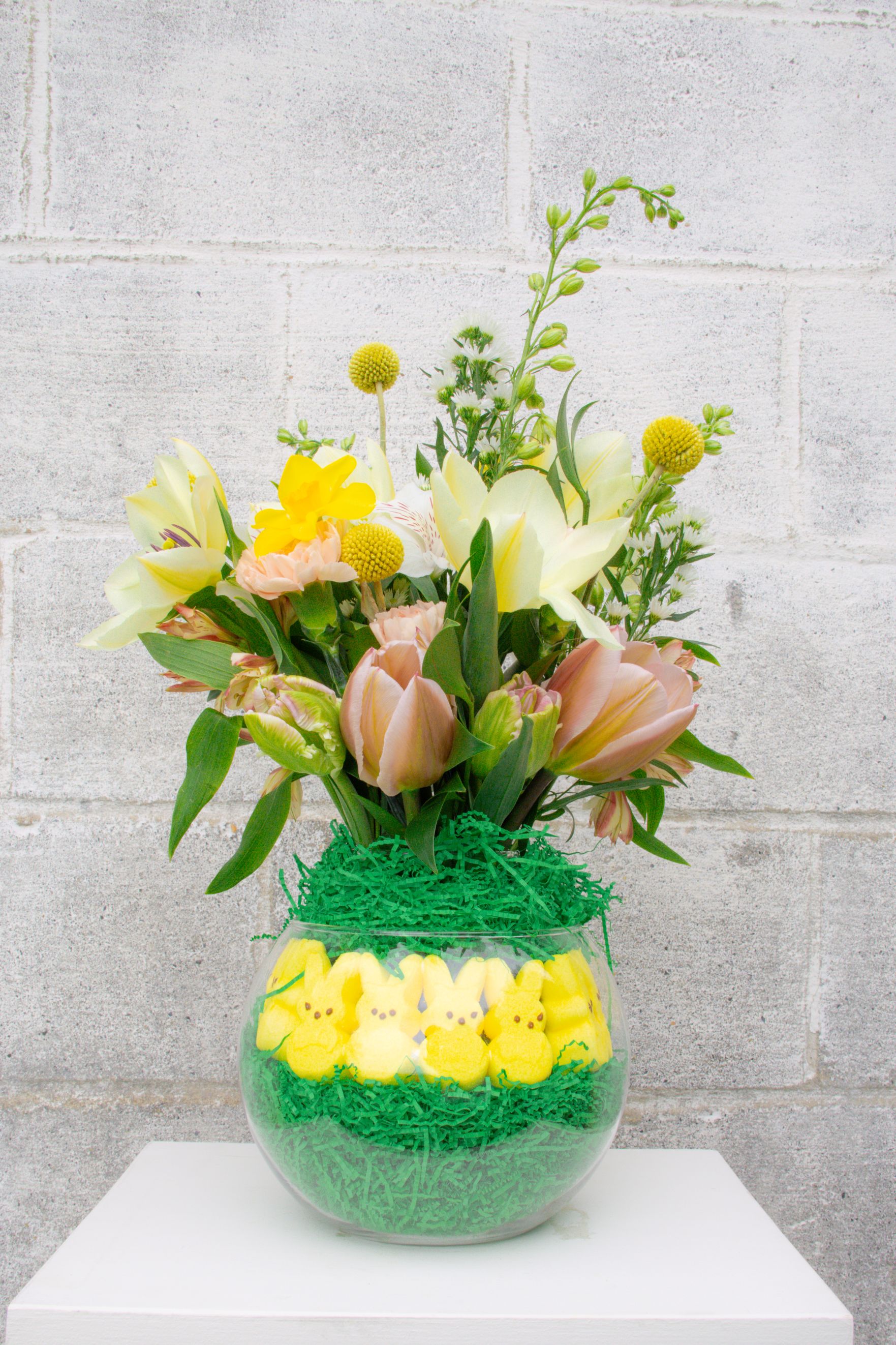 toy-store-20 Peeps candy inside of a glass vase with Easter flower arrangement.