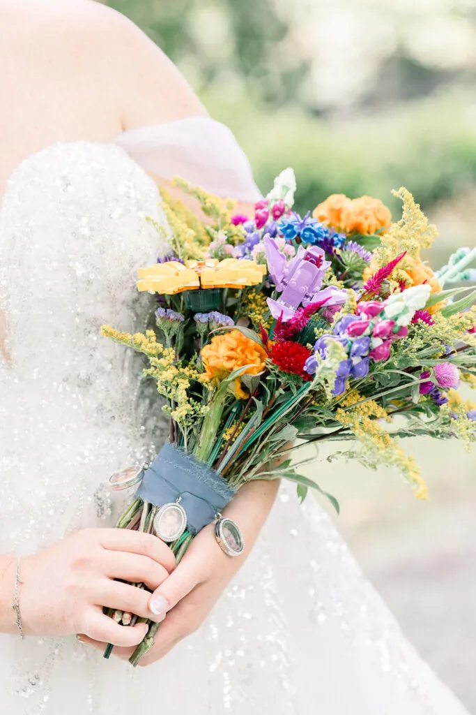 Closeup of bright colored summer wedding bouquet with LEGO flowers.
