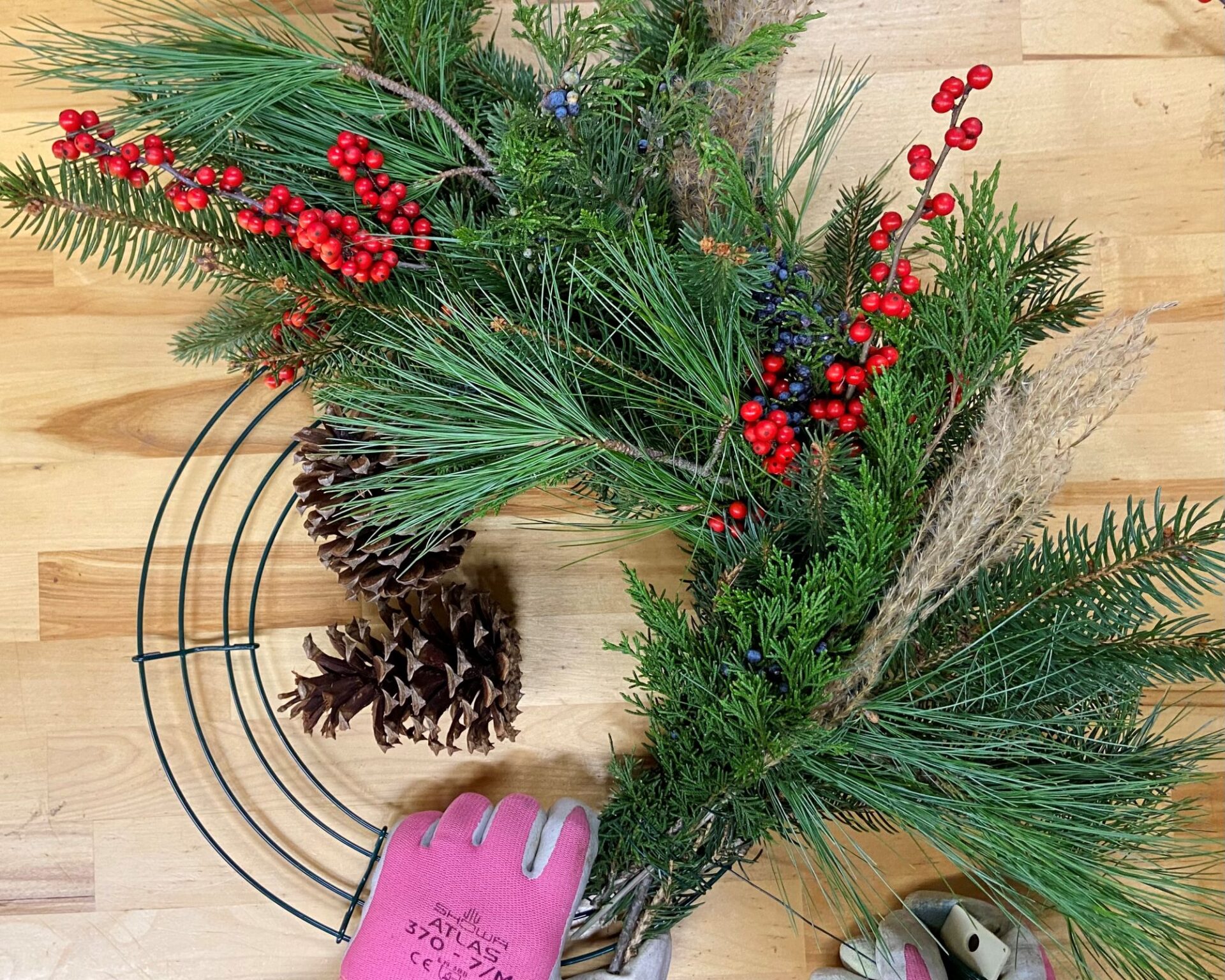 Photo shows halfway through the process of making a DIY Christmas wreath.